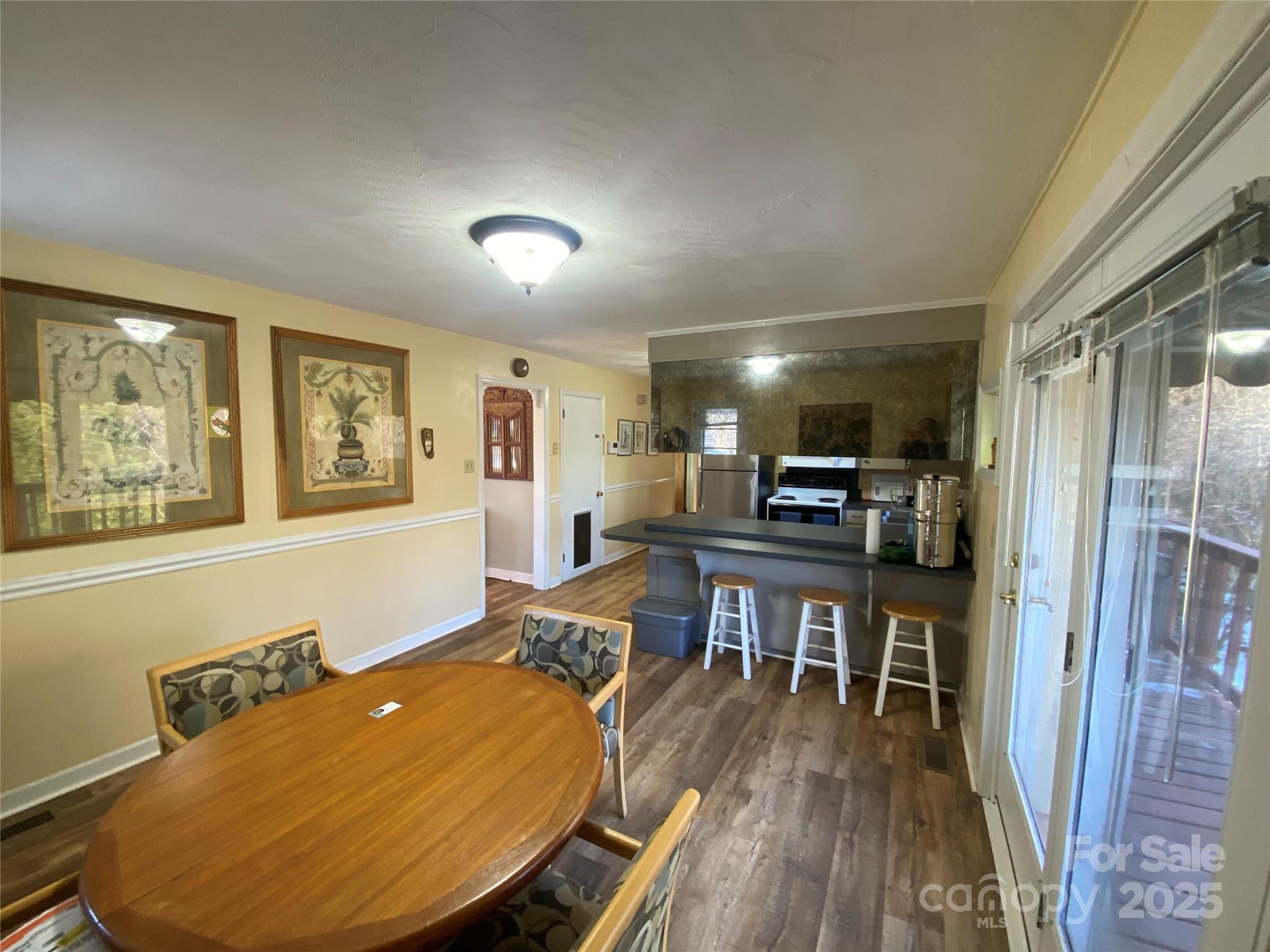 3262 Wilson Heights Drive Hildebran, NC 28637 - Photo 7 of 22 a view of a livingroom with furniture window and wooden floor