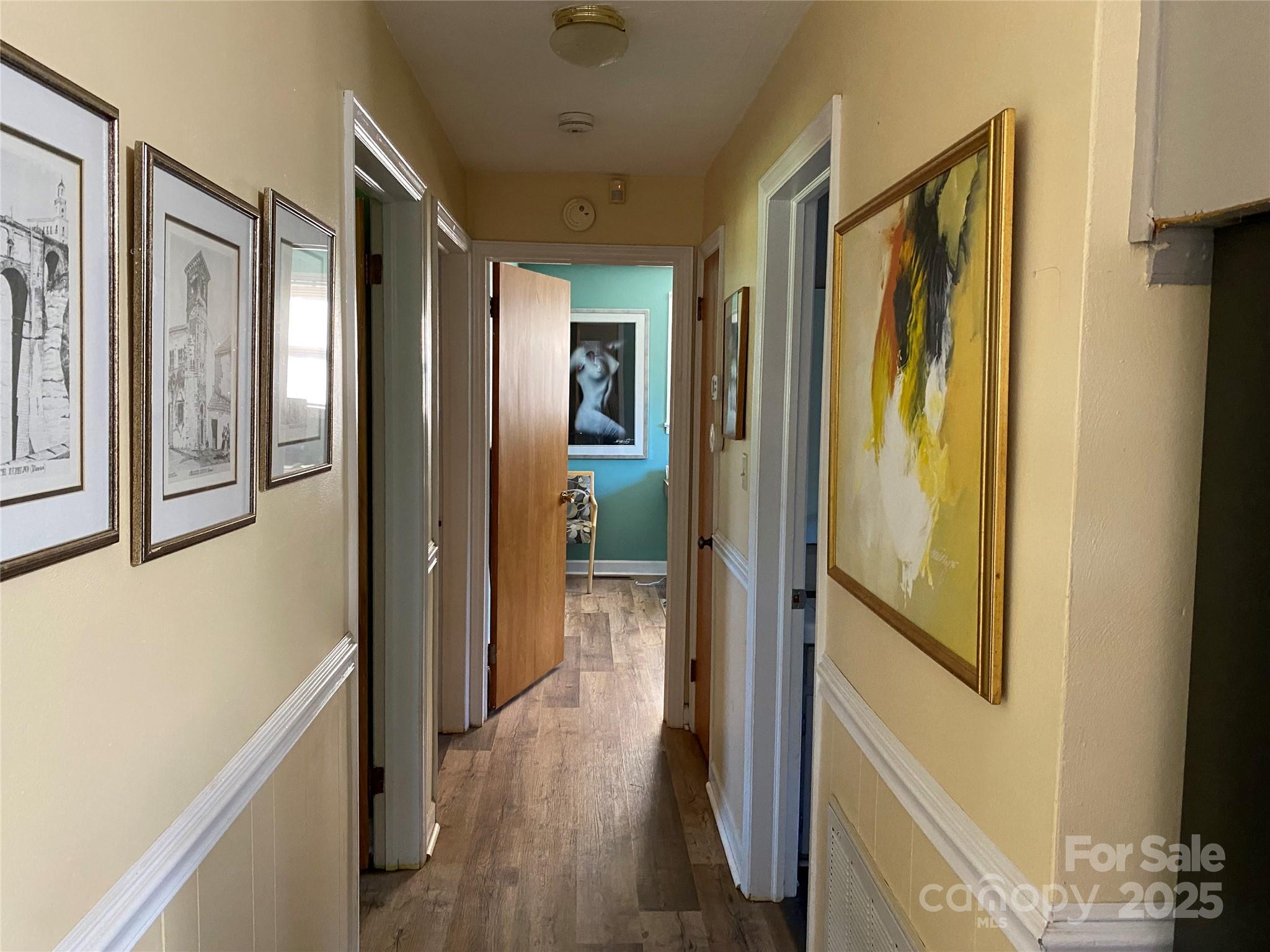 3262 Wilson Heights Drive Hildebran, NC 28637 - Photo 8 of 22 a view of a hallway with wooden floor and staircase