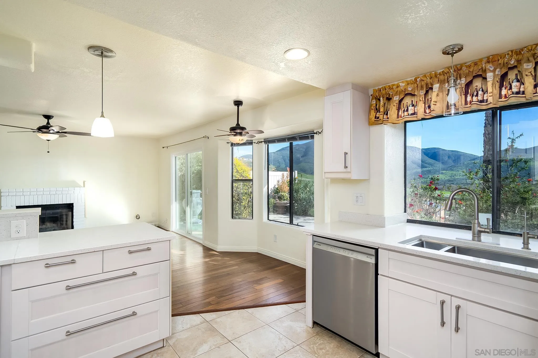 10137 Greenleaf Road Spring Valley, CA 91977 - Photo 11 of 58 a open kitchen with stainless steel appliances granite countertop a stove and refrigerator