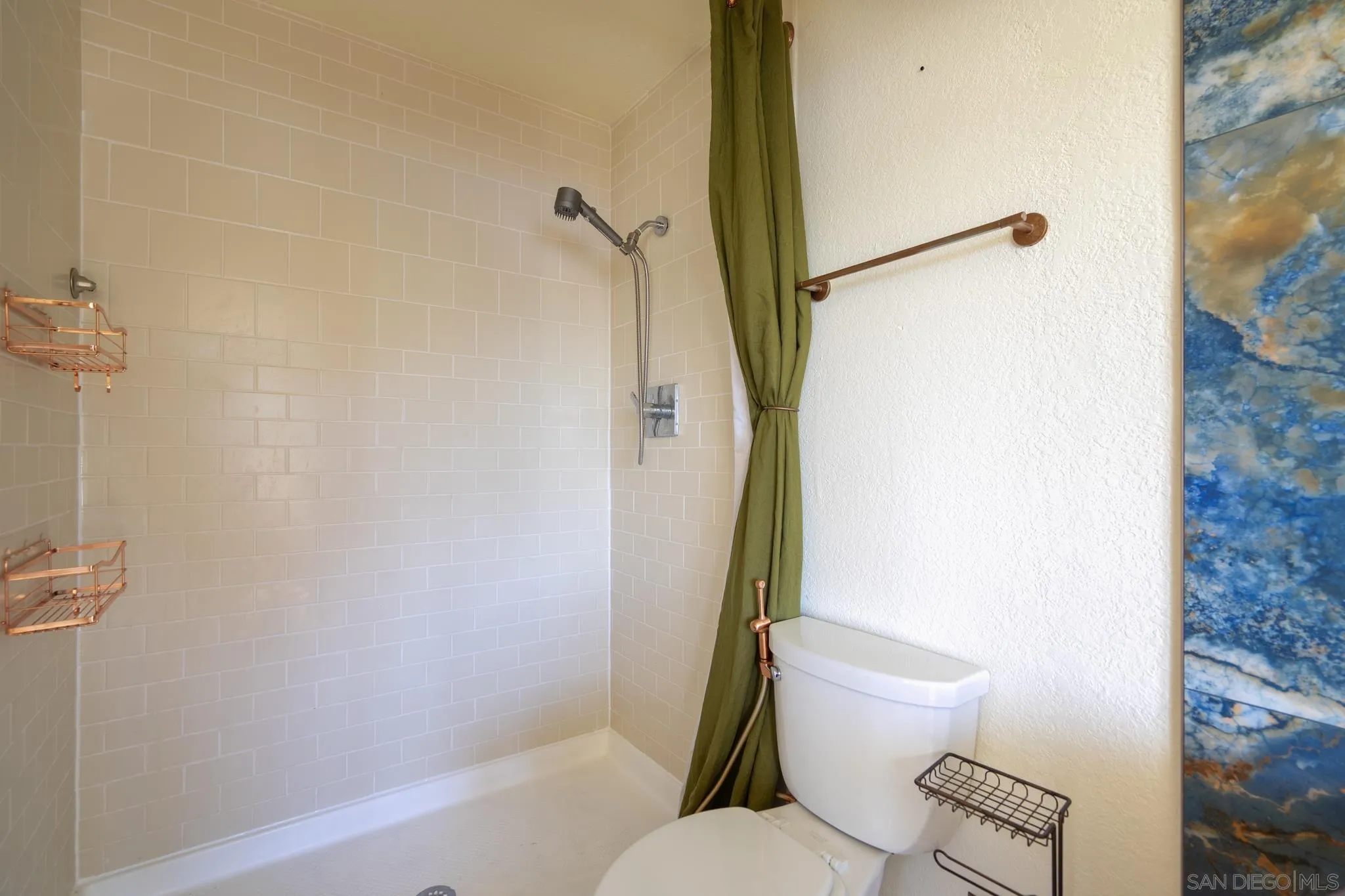 10137 Greenleaf Road Spring Valley, CA 91977 - Photo 24 of 58 a bathroom with a toilet and a shower