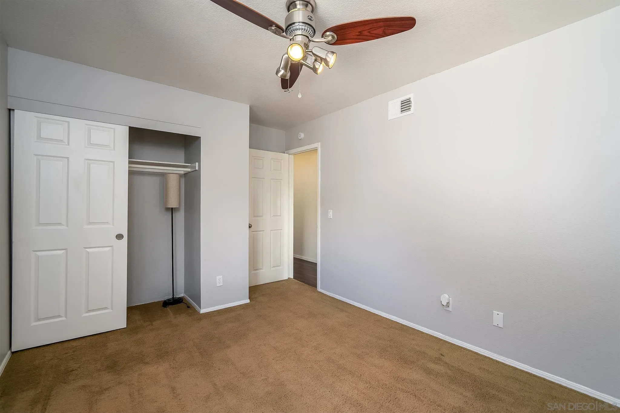 10137 Greenleaf Road Spring Valley, CA 91977 - Photo 29 of 58 an empty room with closet and windows