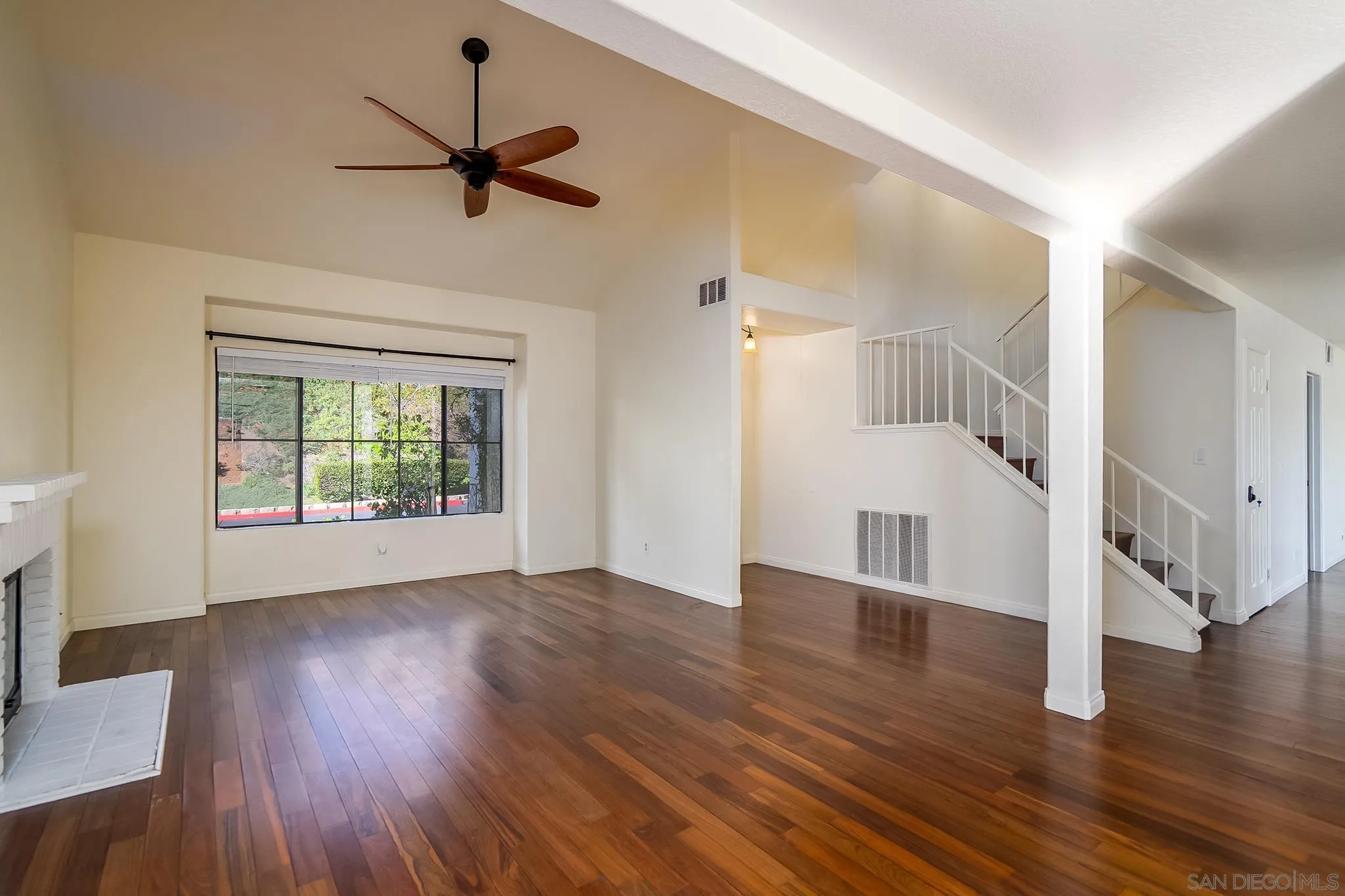 10137 Greenleaf Road Spring Valley, CA 91977 - Photo 5 of 58 a view of an empty room with wooden floor and a window