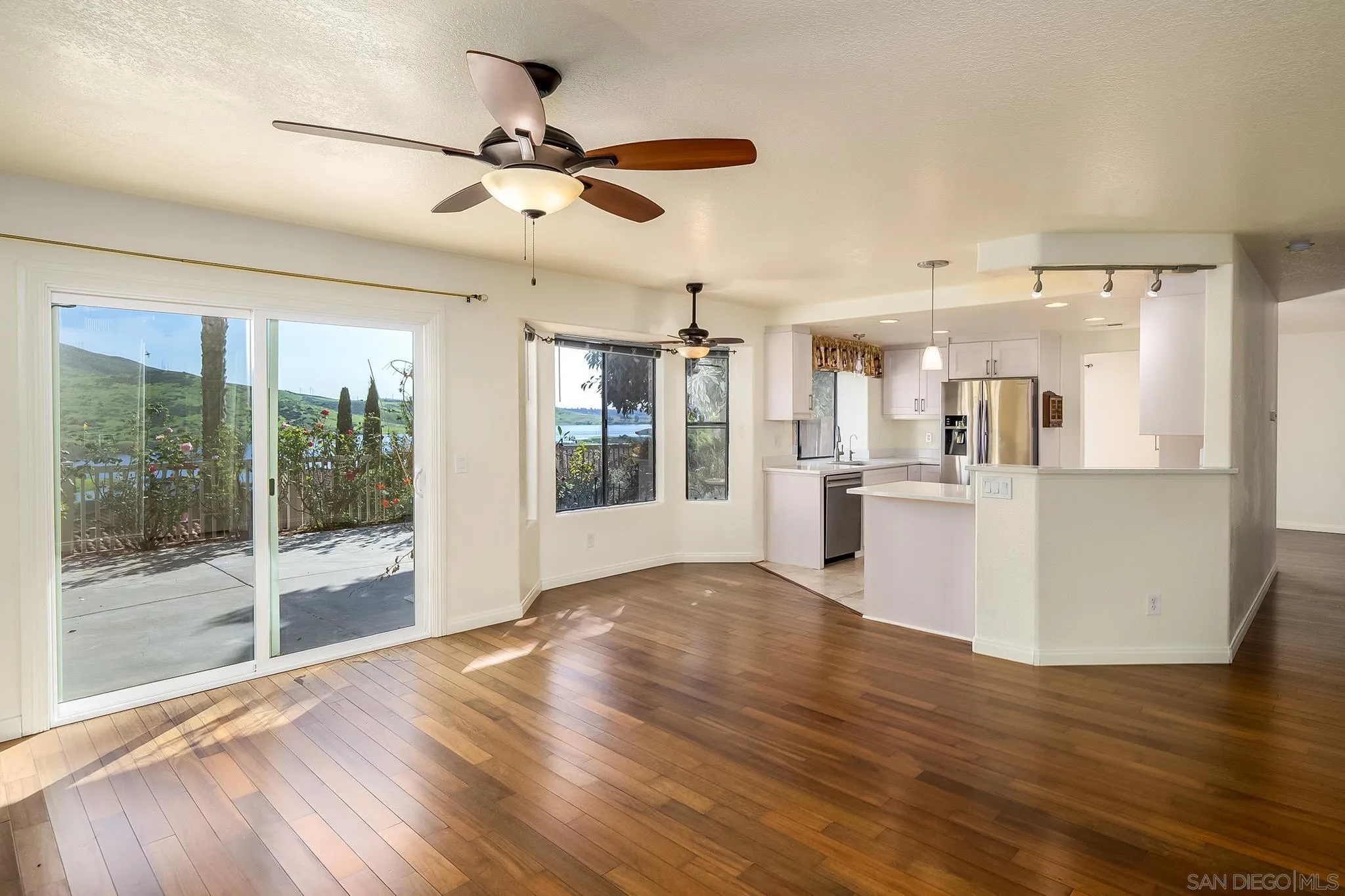 10137 Greenleaf Road Spring Valley, CA 91977 - Photo 8 of 58 a view of a kitchen with wooden floor and a kitchen