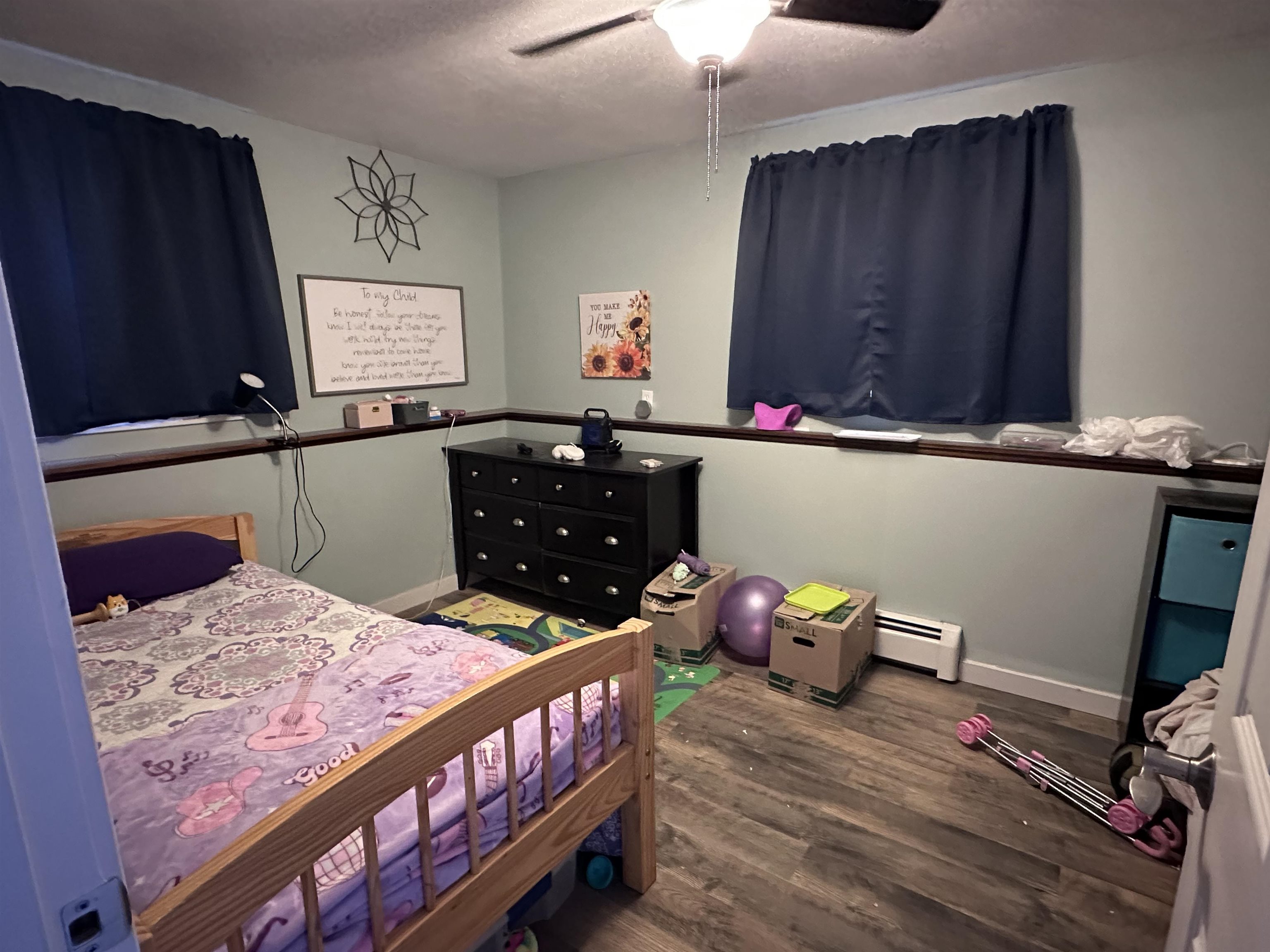 9456 6075th Road Montrose, CO 81403 - Photo 21 of 36 a bedroom with a bed and wooden floor