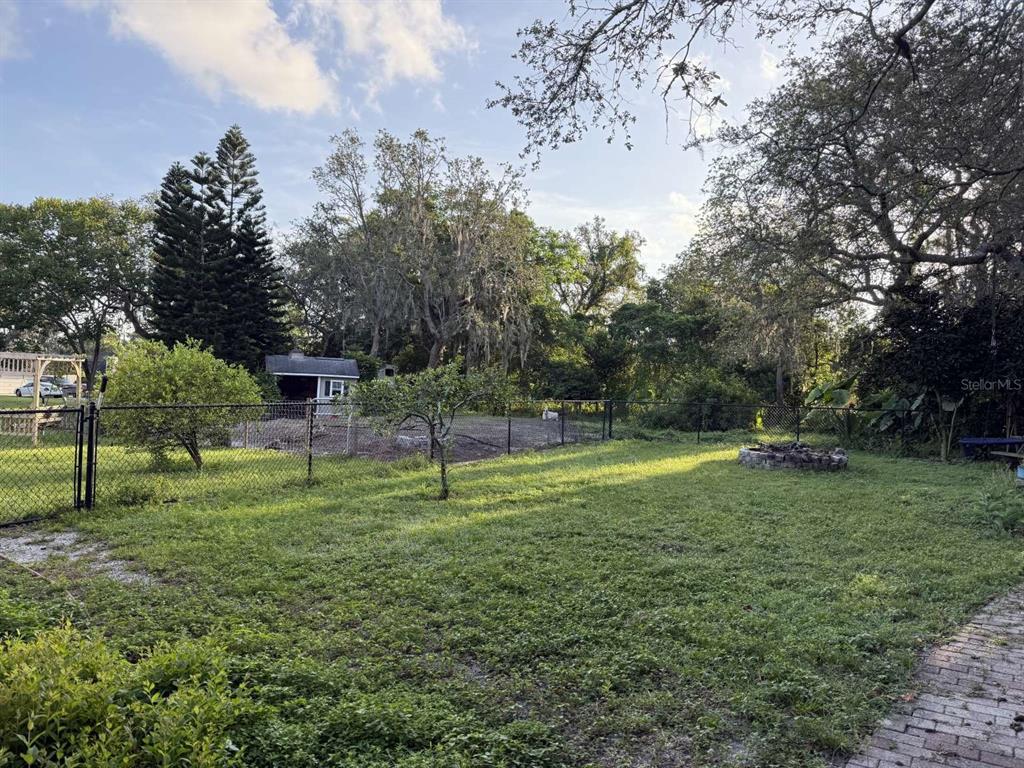 6568 Millstone Drive New Port Richey, FL 34655 - Photo 11 of 26 a backyard of apartments with trees