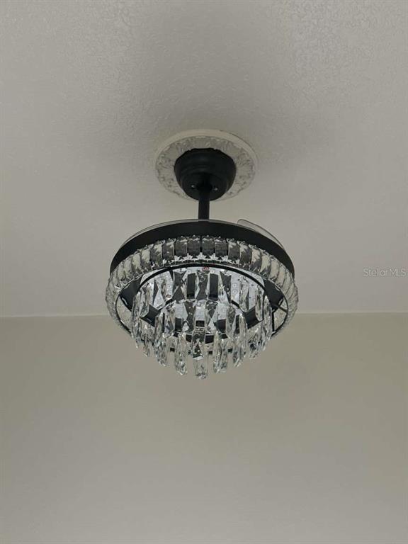 6568 Millstone Drive New Port Richey, FL 34655 - Photo 14 of 26 a close view of a chandelier in room