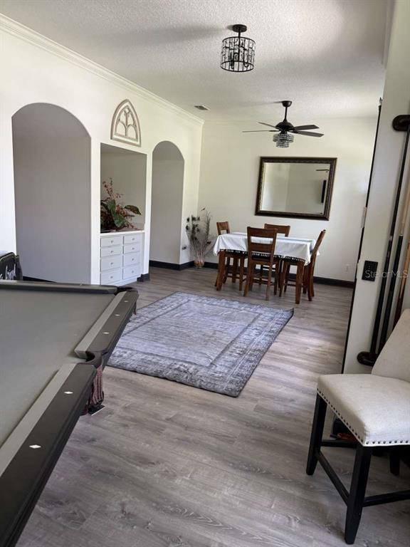 6568 Millstone Drive New Port Richey, FL 34655 - Photo 2 of 26 a living room with furniture and a flat screen tv