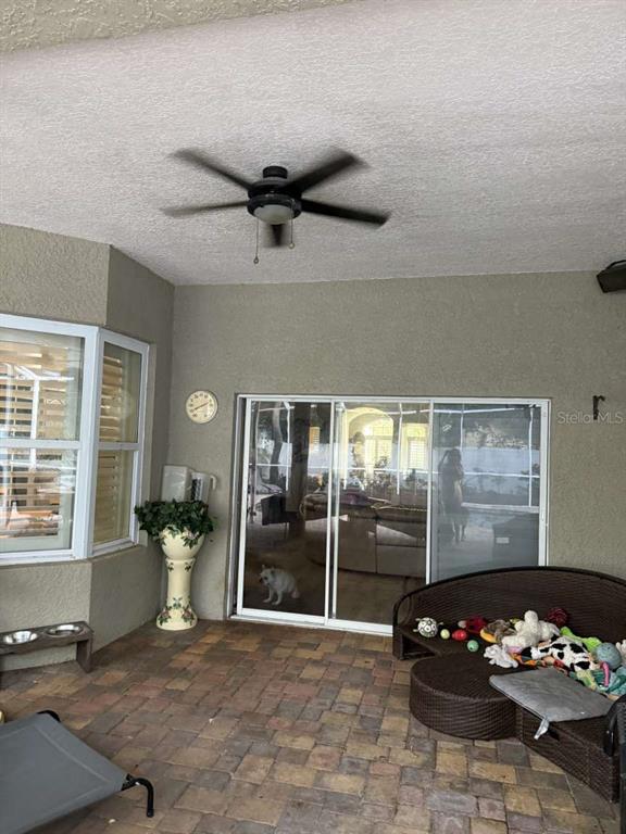 6568 Millstone Drive New Port Richey, FL 34655 - Photo 6 of 26 a living room with blue lights with furniture and white walls