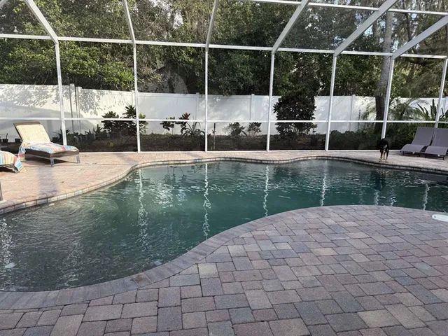 a view of a bathroom with a sink and wooden floor