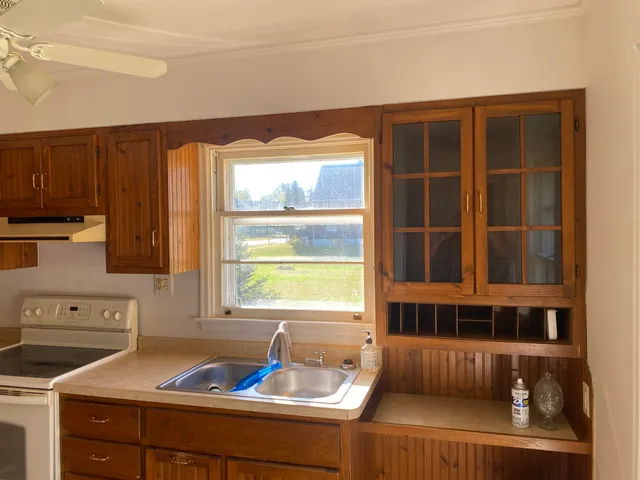 a kitchen with a sink and a window