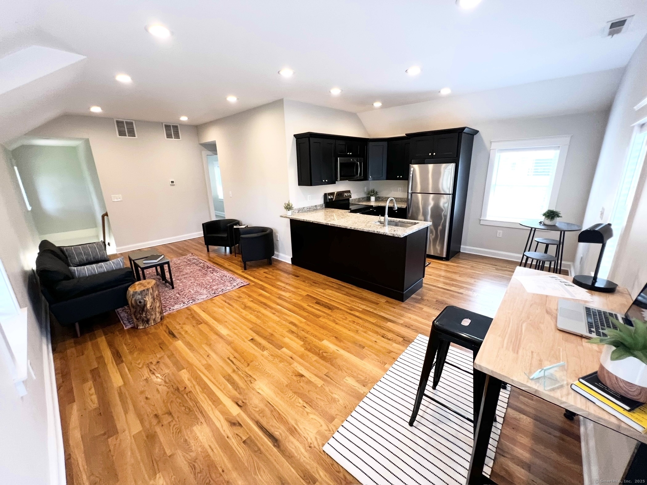 173 Butternut Street, Unit 2 Middletown, CT 06457 - Photo 1 of 1 a large kitchen with a table and chairs