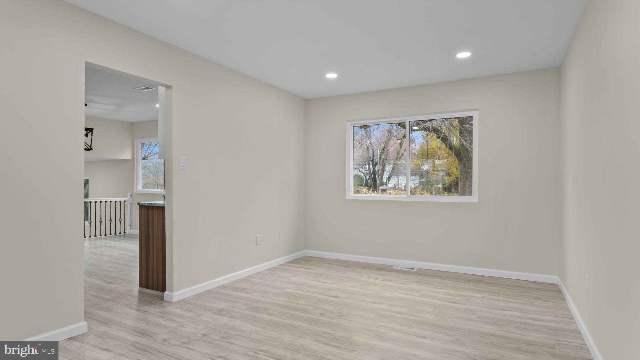 2410 Exton Road Hatboro, PA 19040 - Photo 17 of 63 a view of hallway with a large window and wooden floor