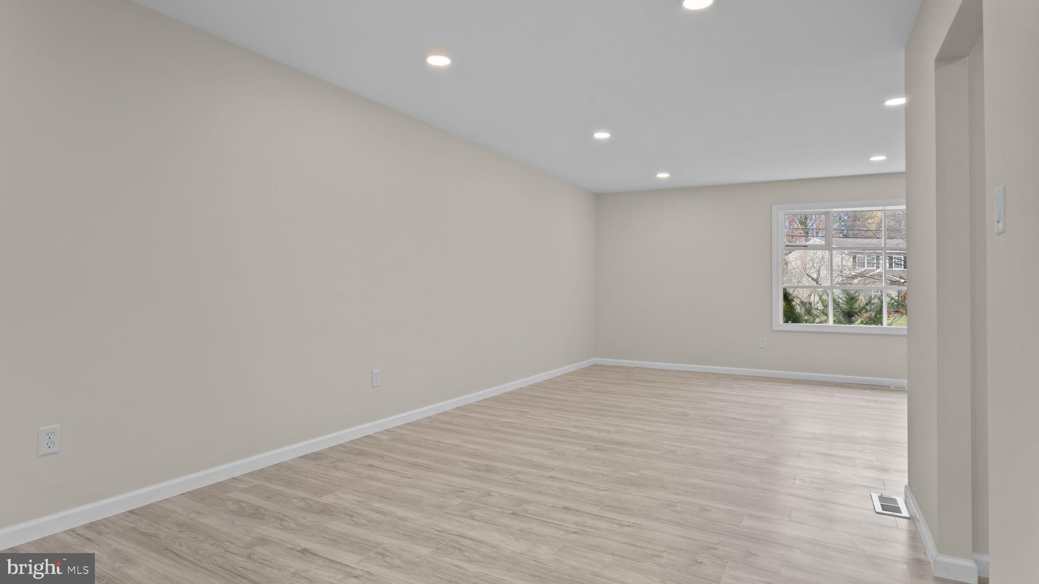 2410 Exton Road Hatboro, PA 19040 - Photo 18 of 63 wooden floor in a hall with a window