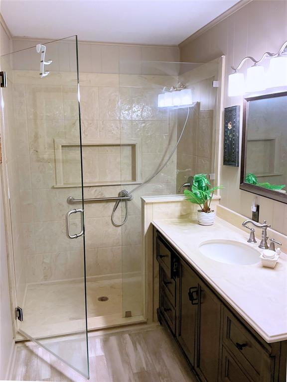 1818 Boot Hill Road Granbury, TX 76049 - Photo 12 of 23 a bathroom with a shower sink and mirror