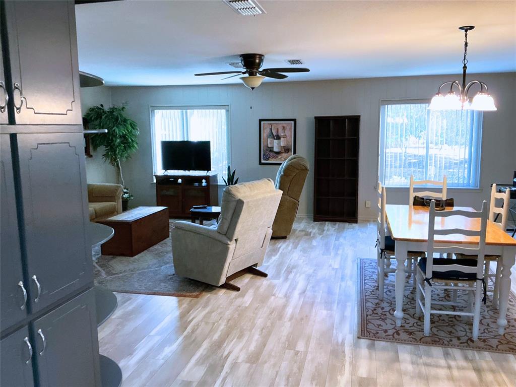 1818 Boot Hill Road Granbury, TX 76049 - Photo 3 of 23 a living room with furniture and a flat screen tv