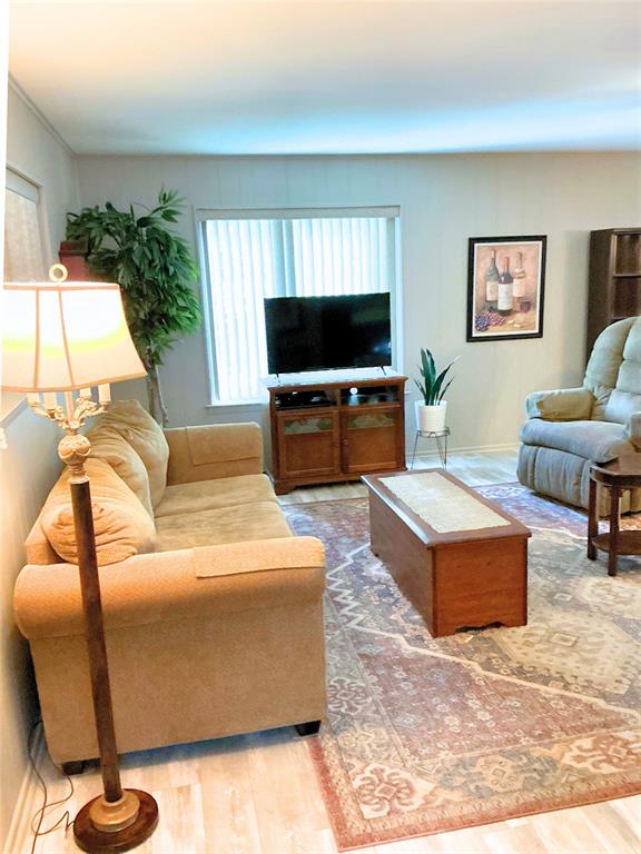 1818 Boot Hill Road Granbury, TX 76049 - Photo 7 of 23 a living room with furniture and a flat screen tv