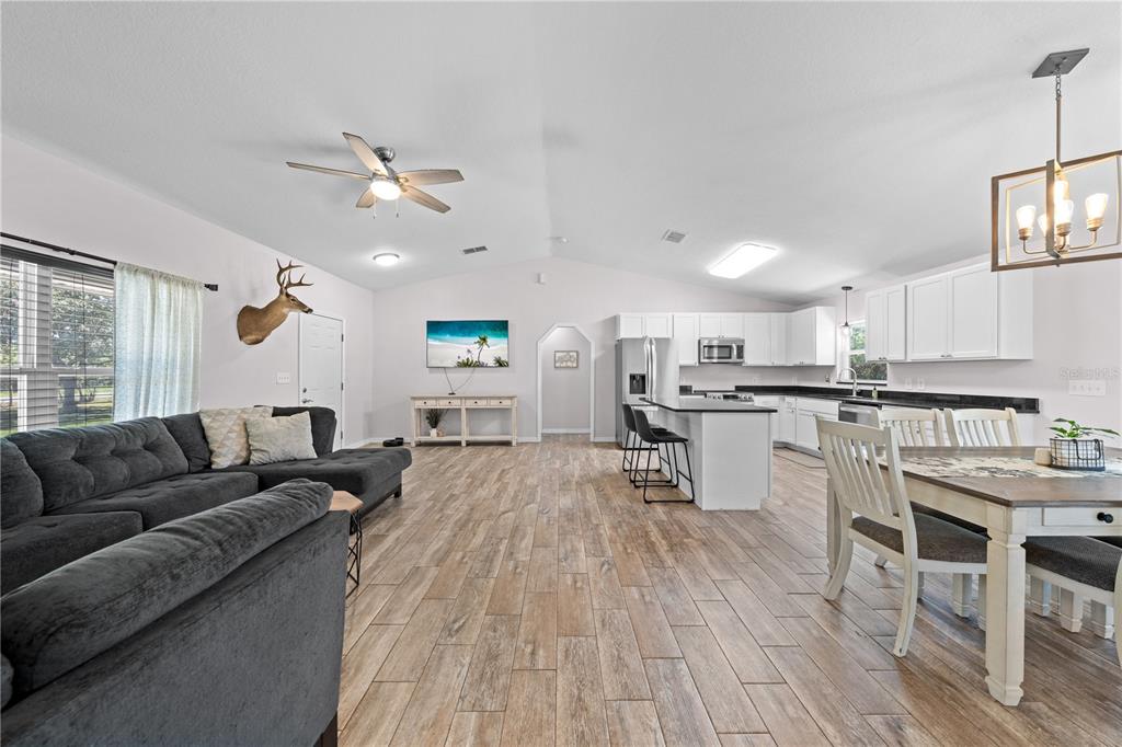 3198 Cherokee Road St. Cloud, FL 34772 - Photo 11 of 43 a living room with furniture and kitchen view