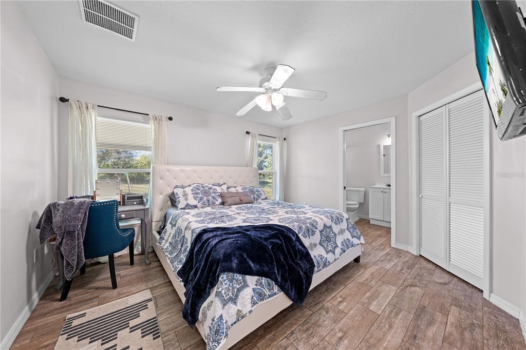 3198 Cherokee Road St. Cloud, FL 34772 - Photo 23 of 43 a bed room with a bed and a chair