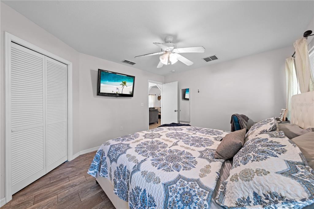 3198 Cherokee Road St. Cloud, FL 34772 - Photo 24 of 43 a bedroom with a large bed and a window