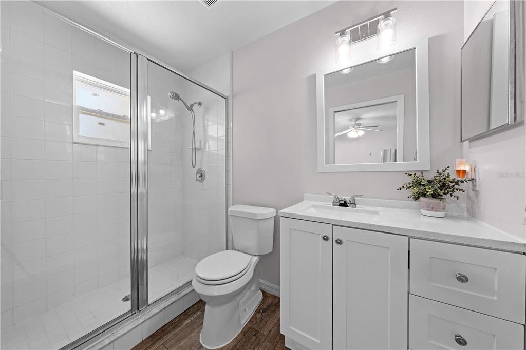 3198 Cherokee Road St. Cloud, FL 34772 - Photo 25 of 43 a bathroom with a sink a toilet and shower