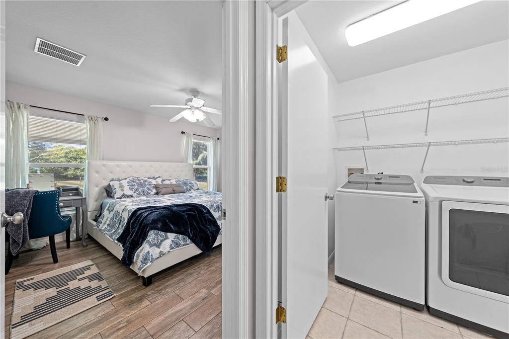 3198 Cherokee Road St. Cloud, FL 34772 - Photo 26 of 43 a bedroom with a bed and a window