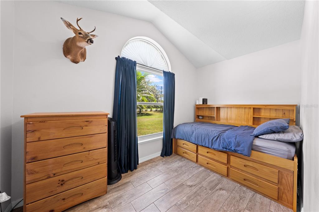 3198 Cherokee Road St. Cloud, FL 34772 - Photo 33 of 43 a living room with furniture and a window