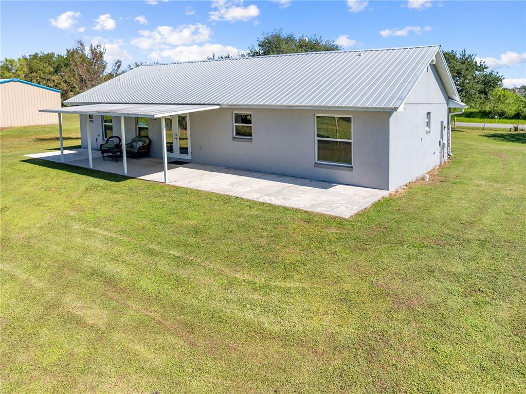 3198 Cherokee Road St. Cloud, FL 34772 - Photo 38 of 43 a view of an house with backyard space and balcony