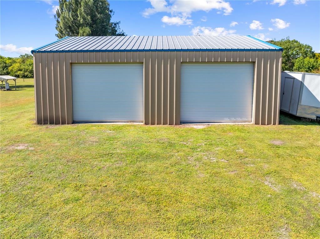 3198 Cherokee Road St. Cloud, FL 34772 - Photo 39 of 43 a view of a house with a garage