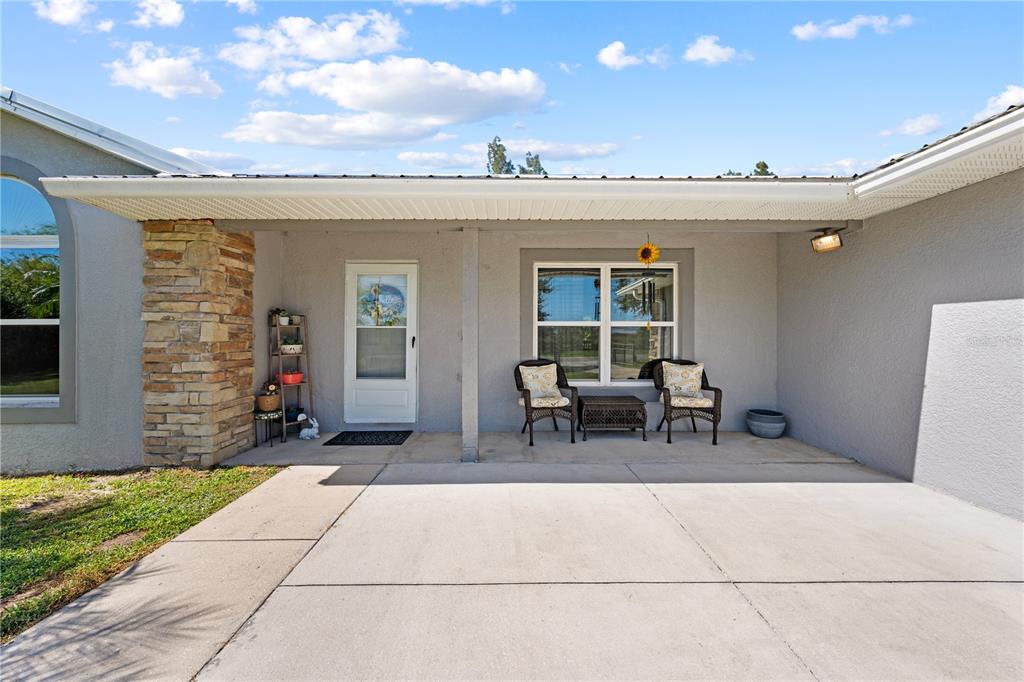 3198 Cherokee Road St. Cloud, FL 34772 - Photo 5 of 43 a view of a patio with table and chairs