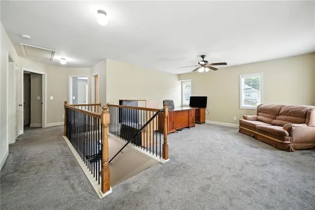 a view of a livingroom with furniture and windows