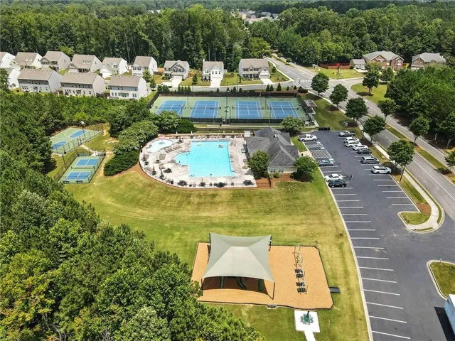 a view of a swimming pool with a yard
