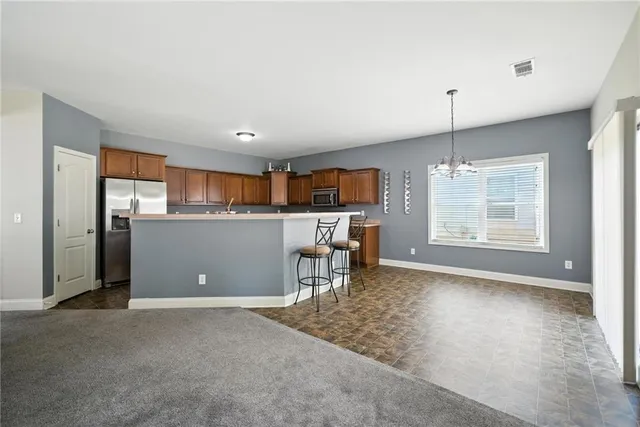 a view of kitchen with furniture and window