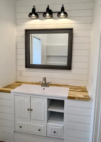 a bathroom with a sink and a mirror