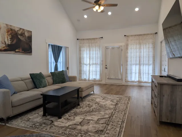 a living room with furniture and a window