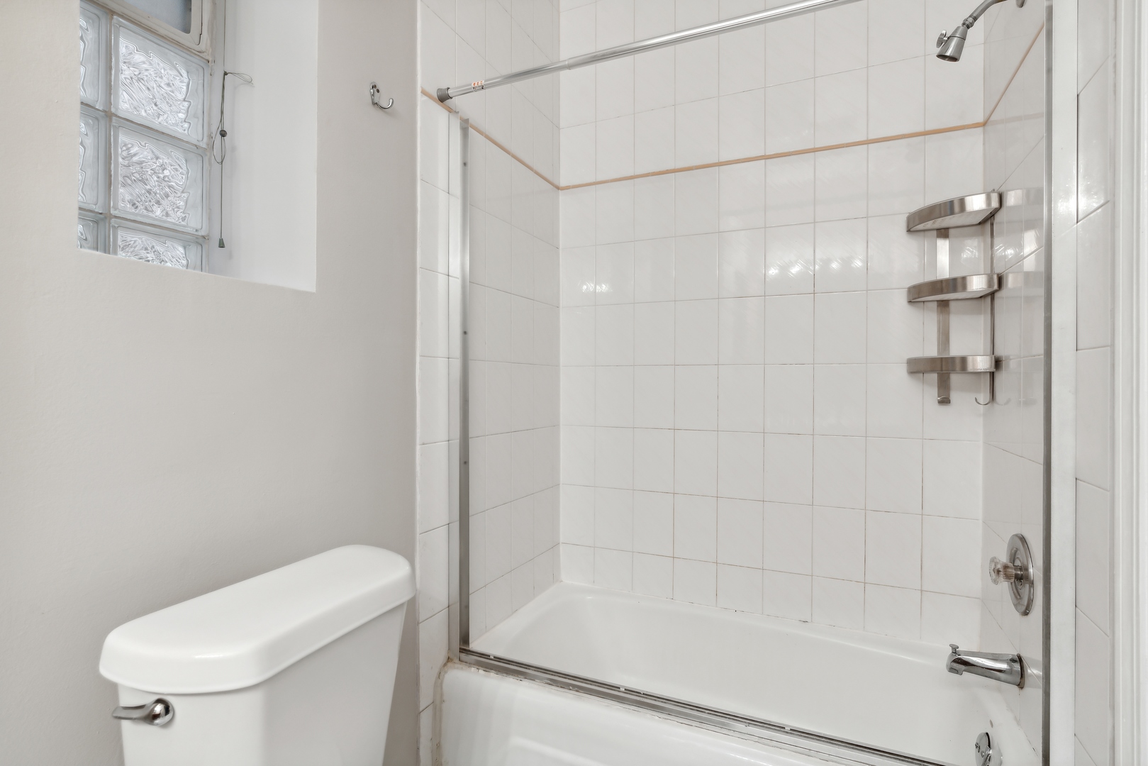 1439 West Lexington Street Chicago, IL 60607 - Photo 18 of 22 a bathroom with a shower a toilet and a shower