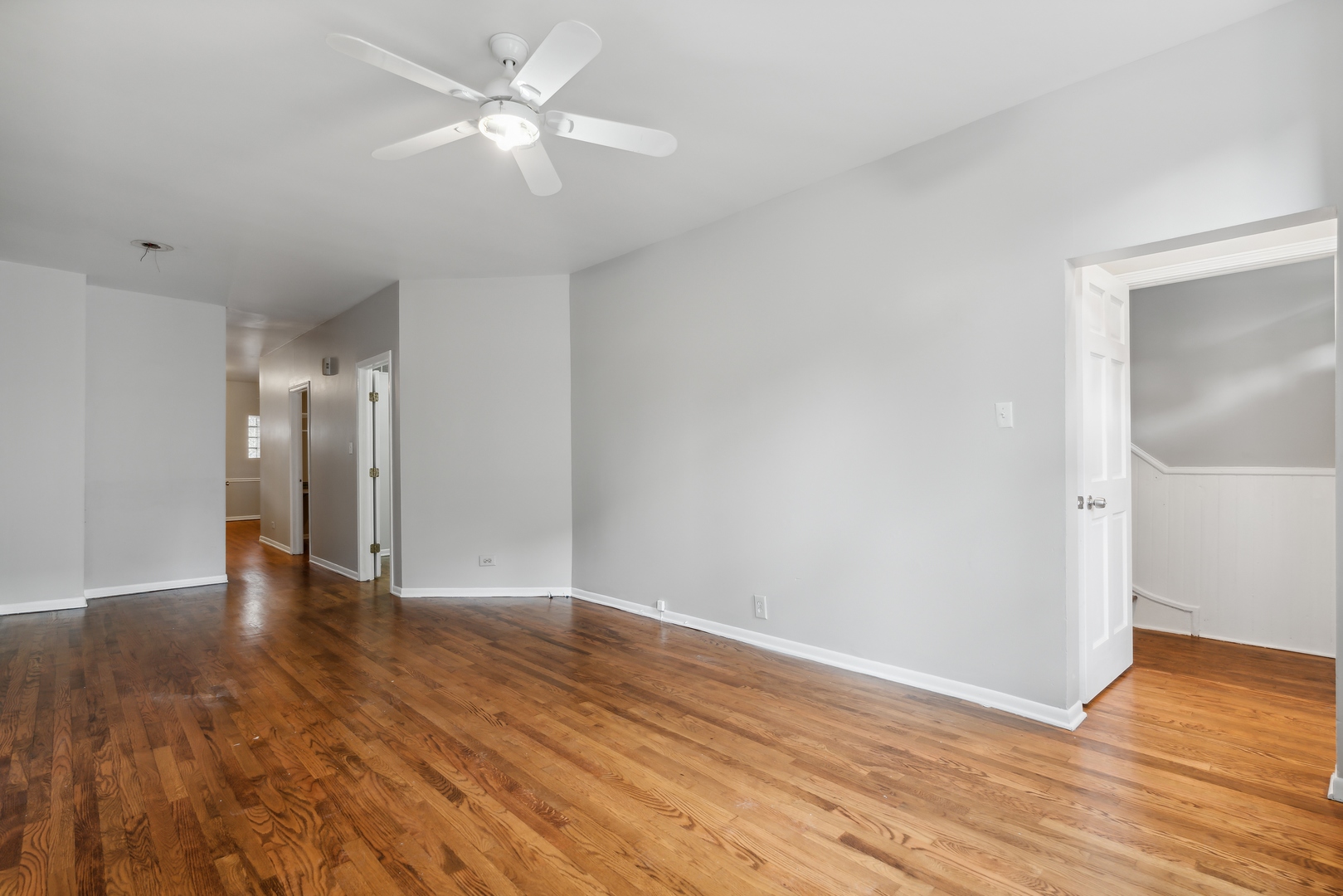 1439 West Lexington Street Chicago, IL 60607 - Photo 4 of 22 a view of an empty room with wooden floor