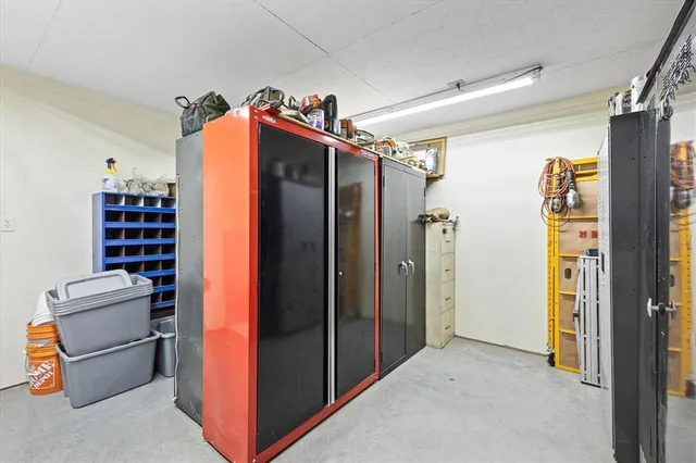 a view of a garage with rack and bicycle