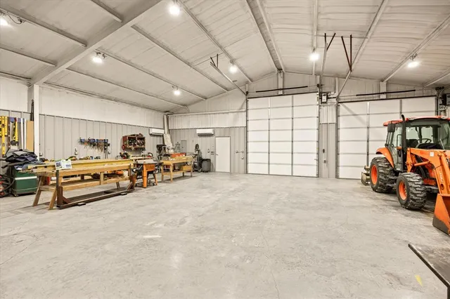 a view of a house with a wooden fence