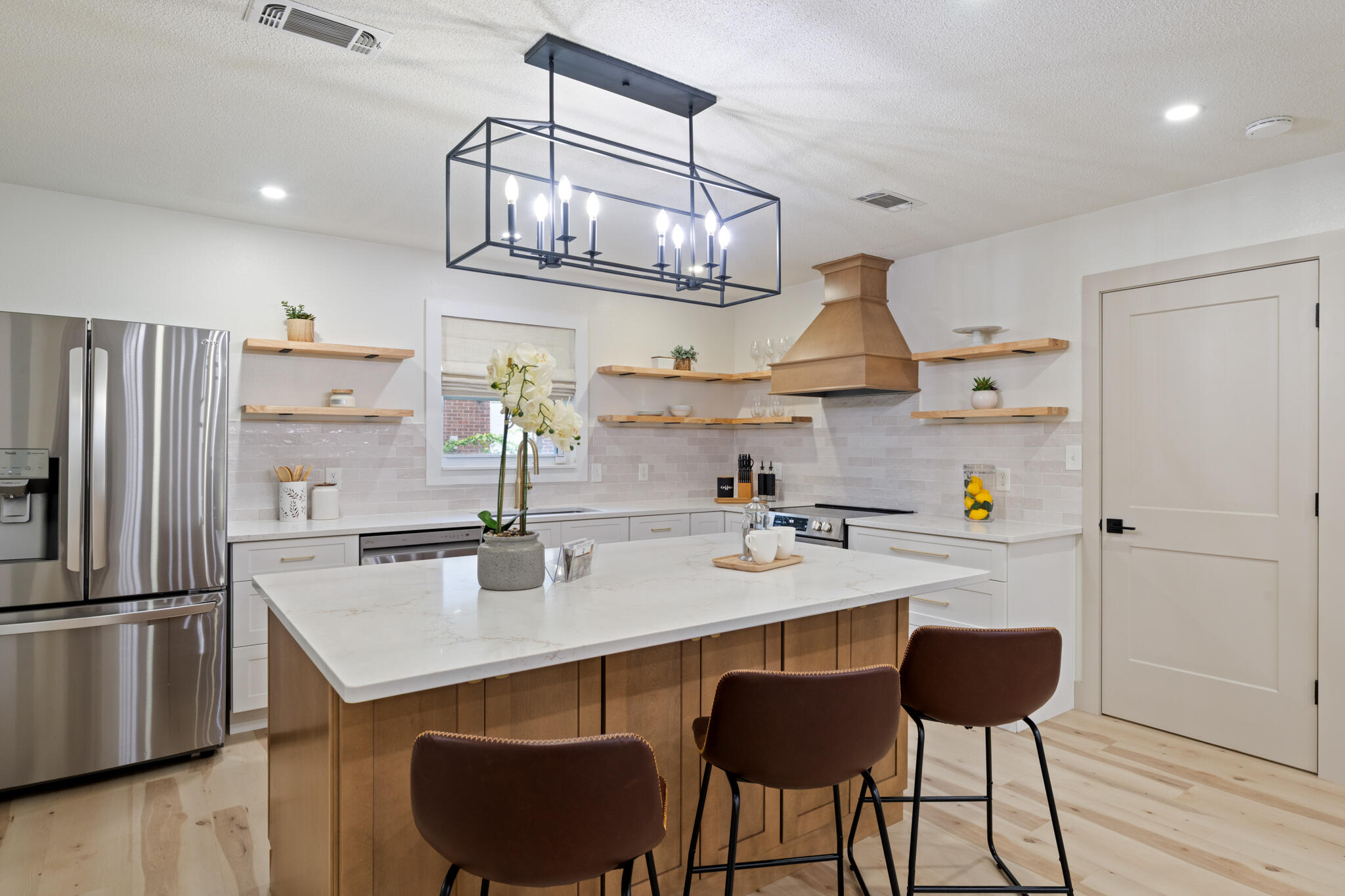 538 22nd Street Niceville, FL 32578 - Photo 11 of 46 a kitchen with stainless steel appliances a sink cabinets and wooden floor