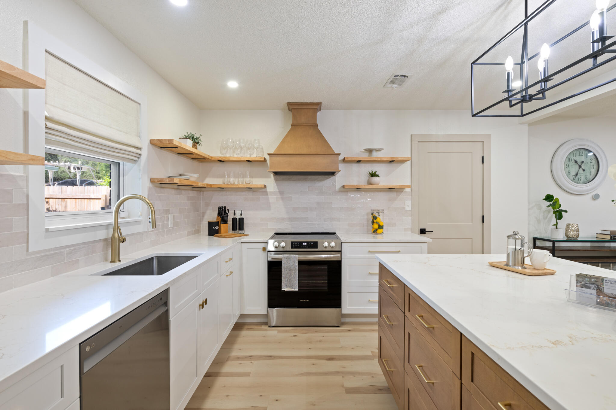 538 22nd Street Niceville, FL 32578 - Photo 12 of 46 a kitchen with a sink stove and cabinets