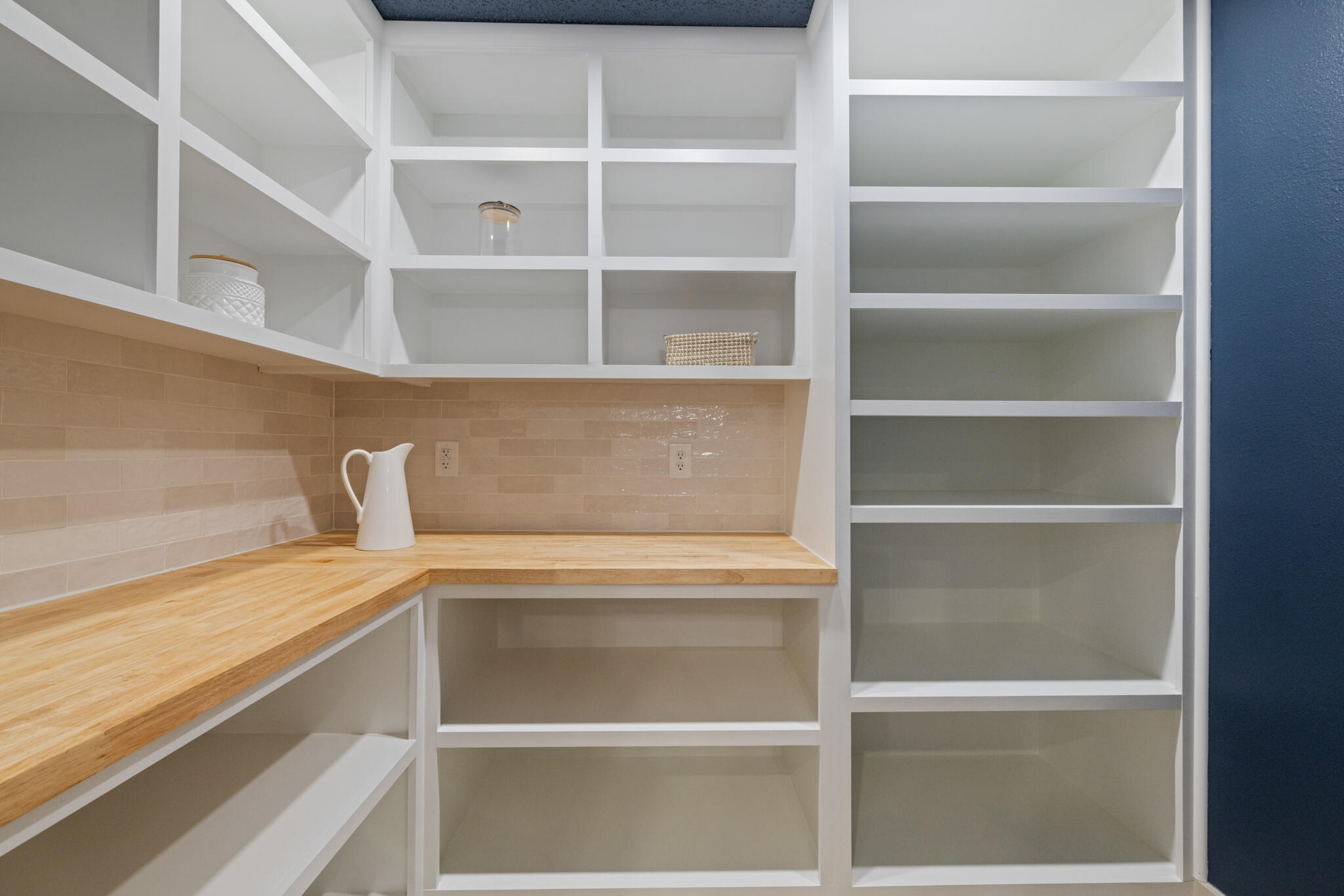 538 22nd Street Niceville, FL 32578 - Photo 14 of 46 a view of walk in closet with empty racks