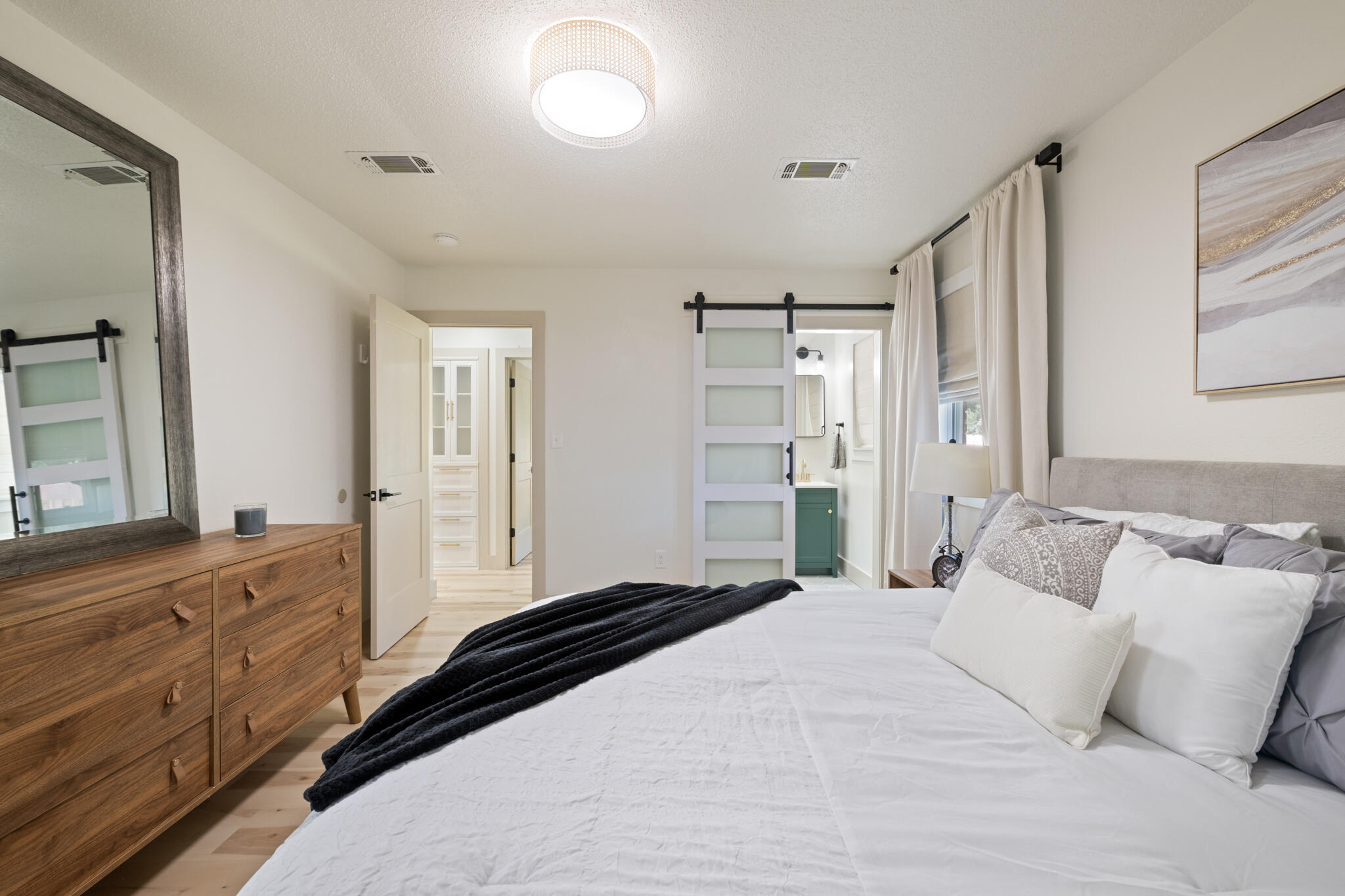 538 22nd Street Niceville, FL 32578 - Photo 20 of 46 a bedroom with a bed and a large mirror on the dresser