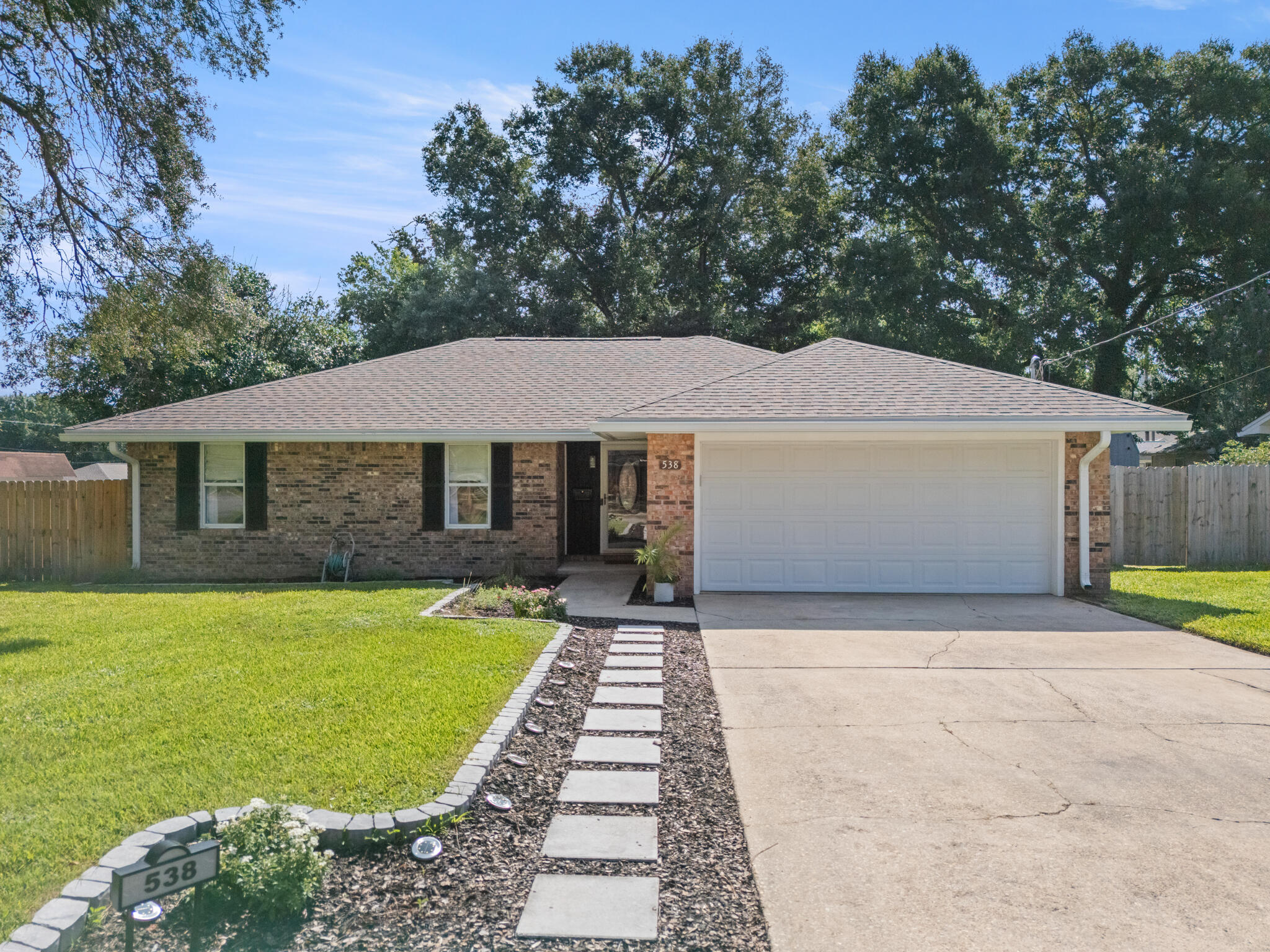 538 22nd Street Niceville, FL 32578 - Photo 2 of 46 a front view of a house with a yard