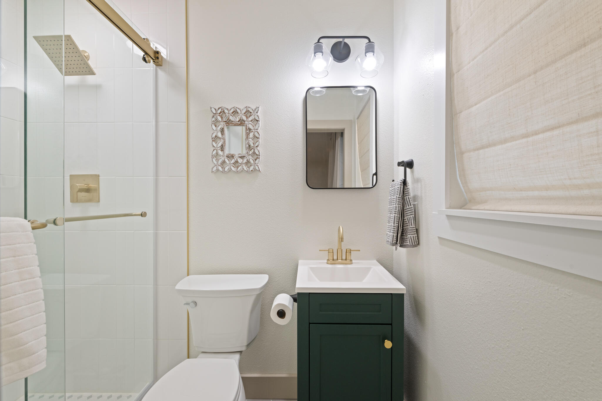538 22nd Street Niceville, FL 32578 - Photo 23 of 46 a bathroom with a toilet sink and mirror