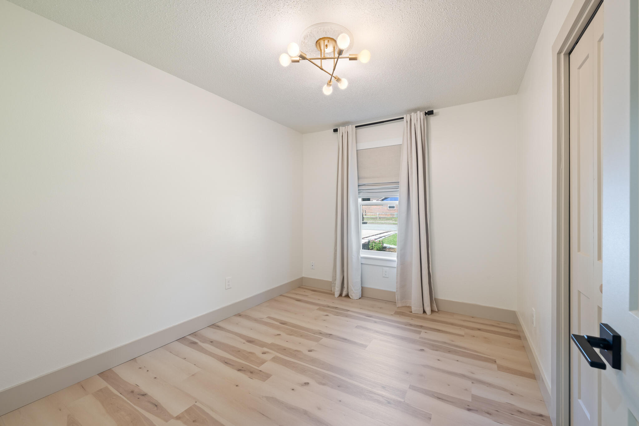 538 22nd Street Niceville, FL 32578 - Photo 25 of 46 a view of empty room with wooden floor