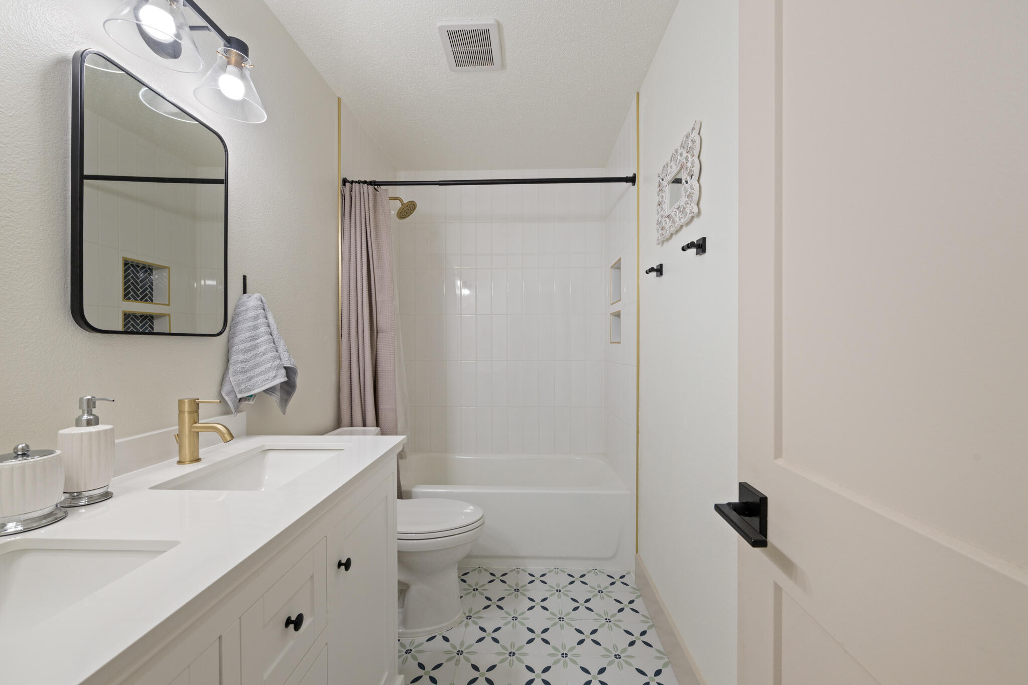 538 22nd Street Niceville, FL 32578 - Photo 28 of 46 a bathroom with a sink a toilet a shower and a mirror