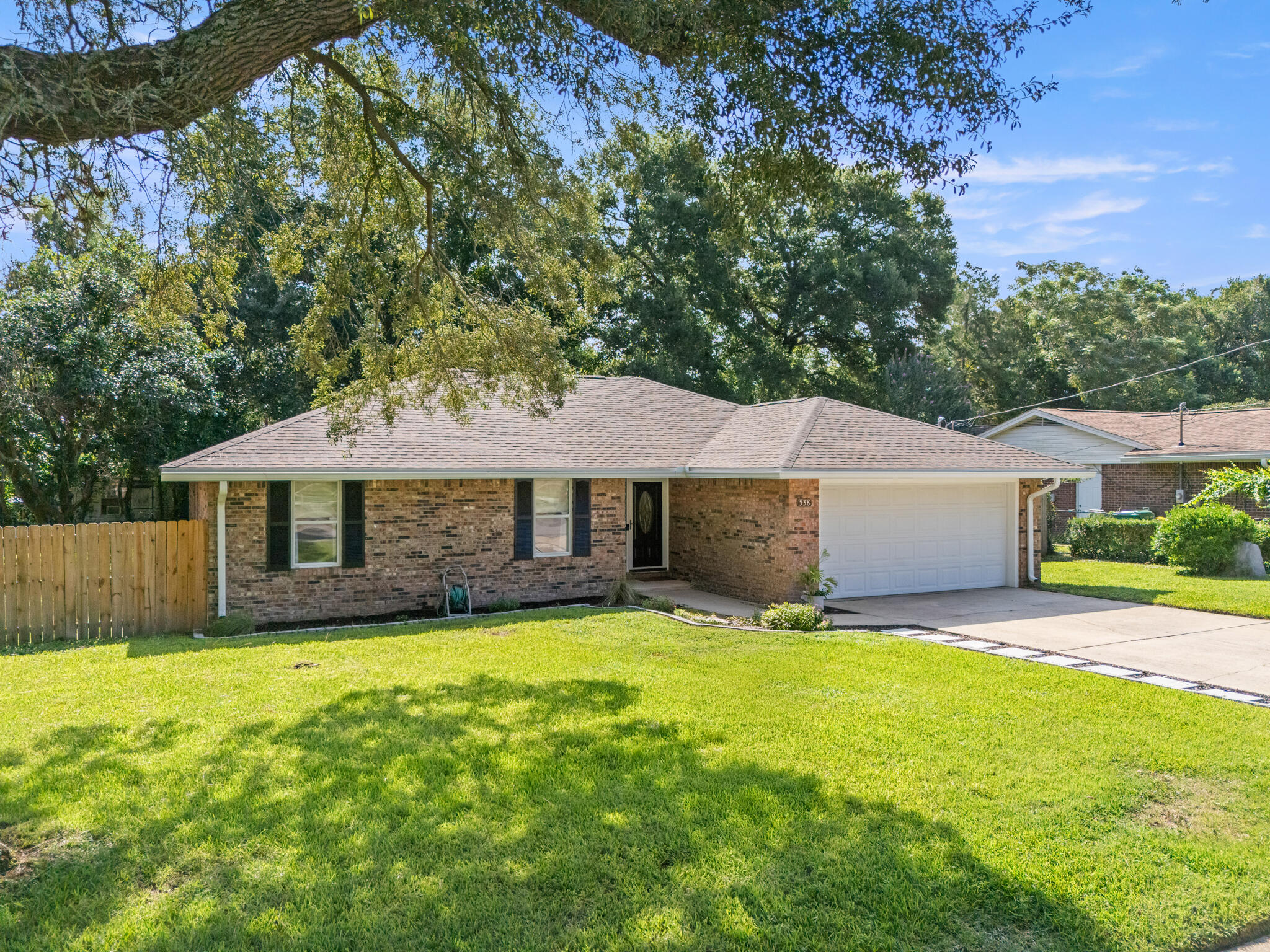 538 22nd Street Niceville, FL 32578 - Photo 3 of 46 a front view of house with yard and trees