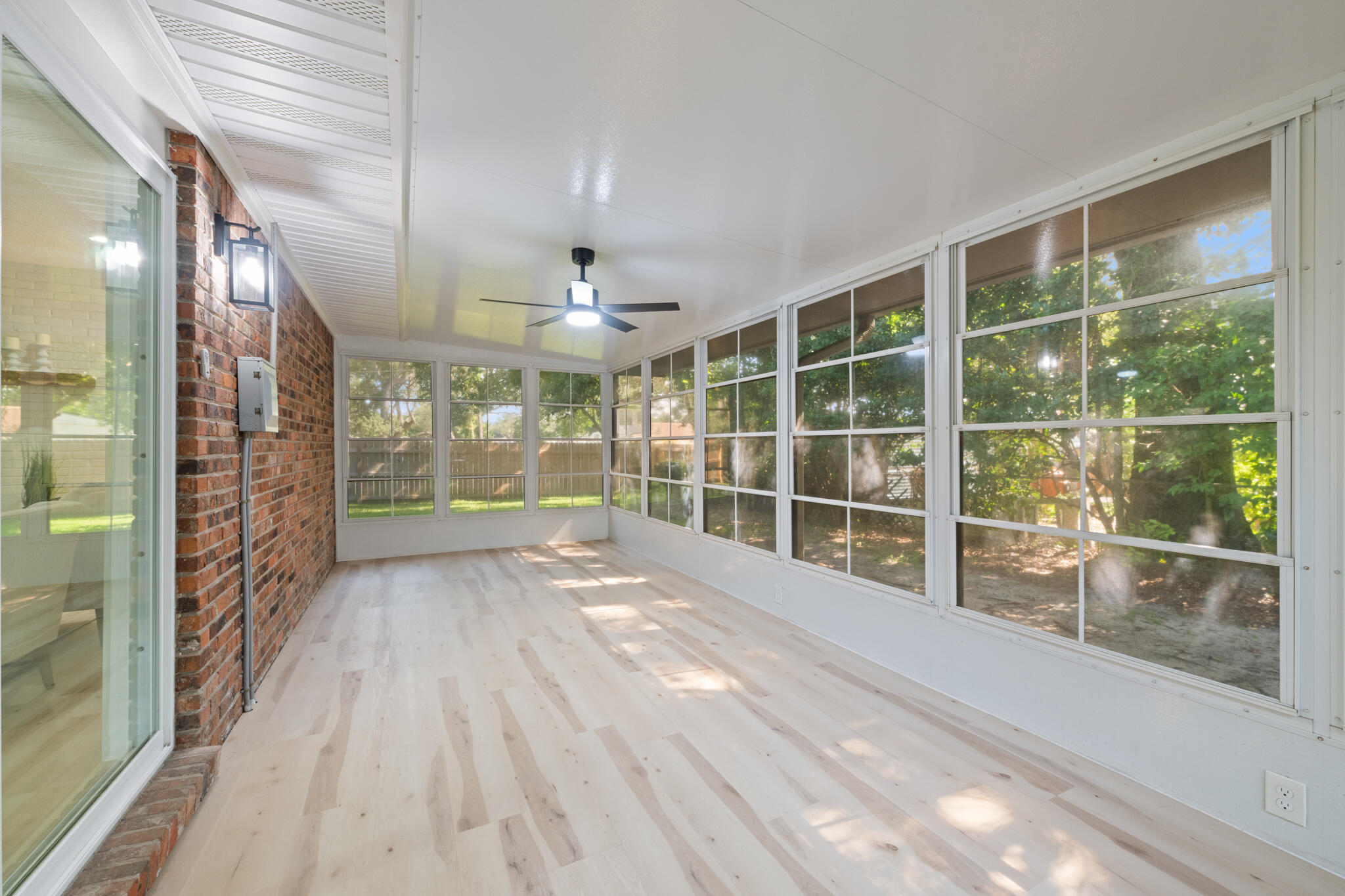 538 22nd Street Niceville, FL 32578 - Photo 39 of 46 a view of empty room with wooden floor and fan