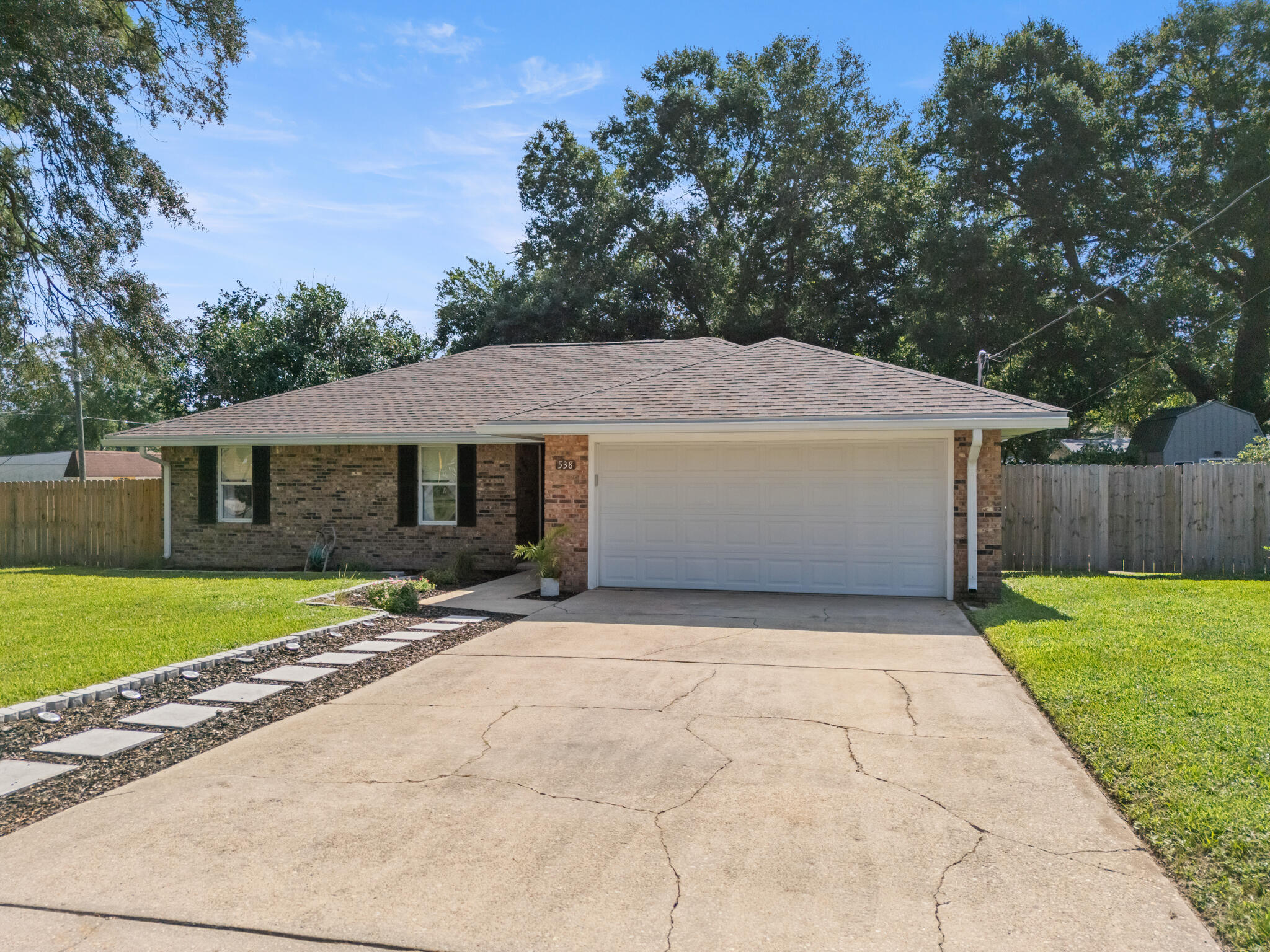 538 22nd Street Niceville, FL 32578 - Photo 4 of 46 a front view of house with yard and trees