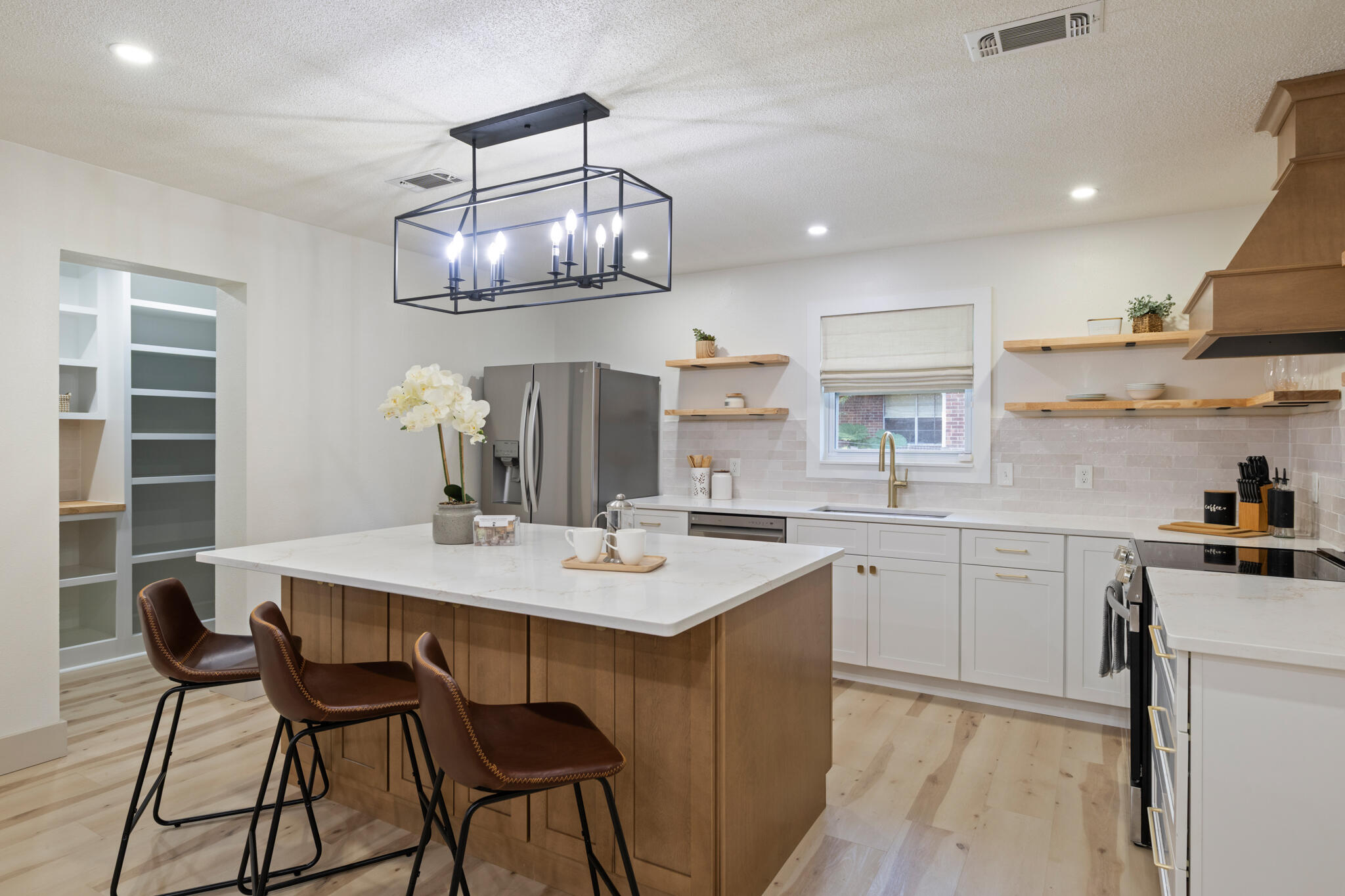 538 22nd Street Niceville, FL 32578 - Photo 10 of 46 a kitchen with a dining table cabinets and stainless steel appliances